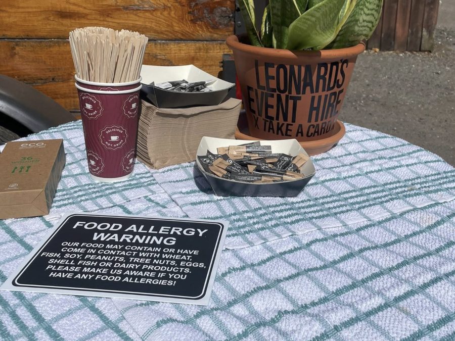 Table set up for a private event, with a Leonard's Event Hire plant pot